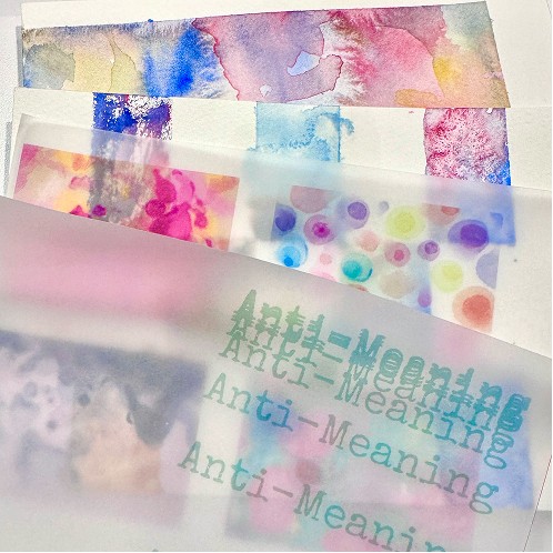 Watercolor pages layered inside a translucent zine cover
